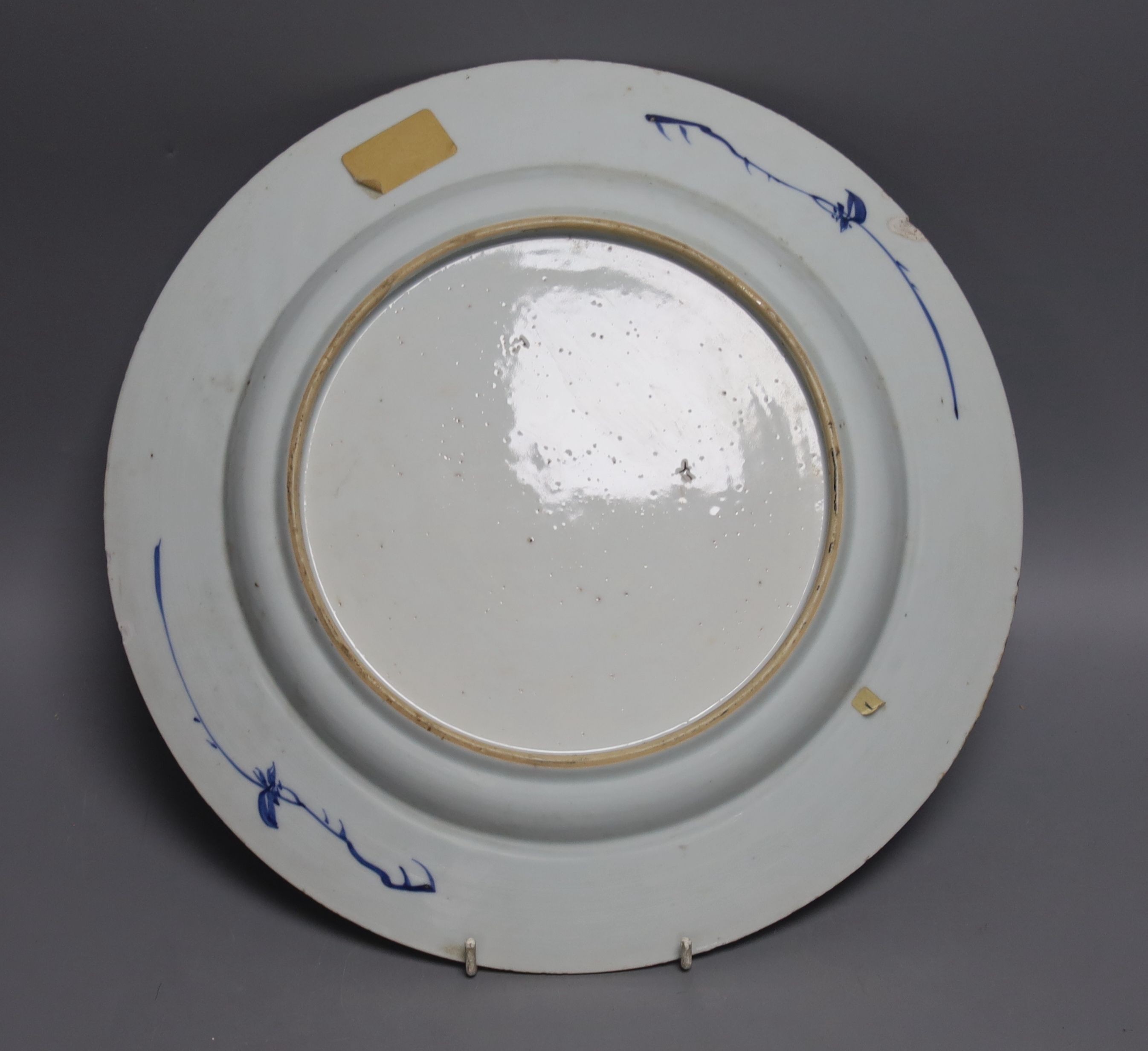 An 18th century Chinese blue and white circular dish decorated with flowering plants, Dia 32.5cm